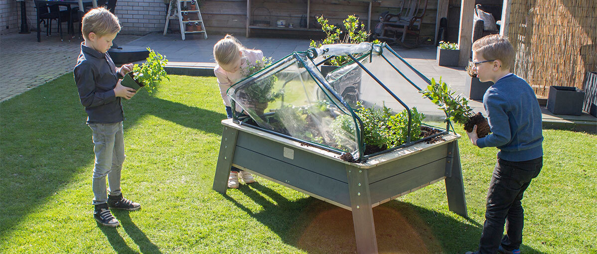 Playing outside in a small garden with EXIT Toys